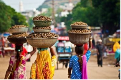 Women Carrying Baskets on Their Heads