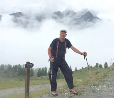 john-wearing-suspenders-hiking-with-fog-in-the-background